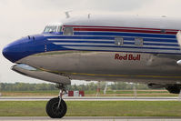 N996DM @ VIE - Red Bull DC6 - by Yakfreak - VAP