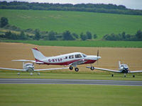 G-BYSP @ EGSU - Piper PA-28-181/Landing at Duxford - by Ian Woodcock