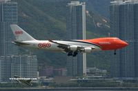 OO-THB @ VHHH - Colorful TNT approaching runway 25L - by Michel Teiten ( www.mablehome.com )