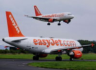G-EZDA @ EGGP - Easyjet Airbus on hold as G-EZIE comes into land - by chris hall