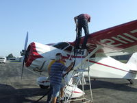 N21117 @ 9G5 - Father and brother helping refuel the Stinson at Royalton. - by Terry L. Swann