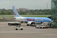 D-AHFC @ EDDL - Striking colour schemme on the Hapagfly 737 amongst the clutter at Dusseldorf - by Steve Hambleton