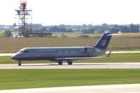 N910SW @ CID - Taxiing on Alpha to the ramp.  Looking through my dirty window. - by Glenn E. Chatfield