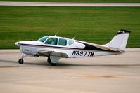 N8977M @ CID - Taxiing to Runway 27 for departure. - by Glenn E. Chatfield