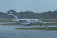 N525AL @ ORL - Cessna 525 taxiing out in pouring rain