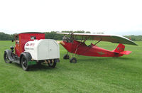 N12942 @ IA27 - This picture could be from 1932 !! The APM's Model A Ford powered Pietenpol Sky Scout and a Model A fuel truck pose for this picture at Antique Airfield near Blakesburg, IA - by BTBFlyboy