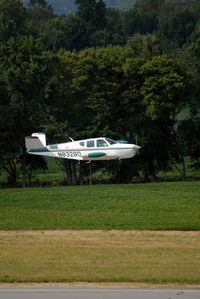 N8326D @ ESN - Gear-up Fly-by at Easton Airport - by Robert Schulte