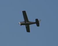 N2181S - Cessna 210 in holding pattern over Lake Parker on way to Sun N Fun