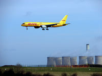G-BIKF @ EGNX - DHL B757 on Traing flight passes the distinctive cooling towers on approach to East Midlands Runway 27 - by Terry Fletcher