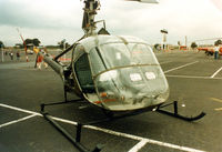 N6057 @ TX08 - Hiller OH-23B at a Helicopter show in the former Texas Rangers baseball stadium parking lot.