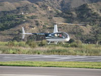 N144WB @ SZP - 1998 Robinson R44 RAVEN, Lycoming O-540, liftoff after discharging three pasengers - by Doug Robertson