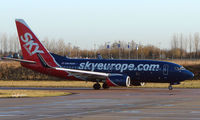 OM-NGM @ EGGW - Sky Europe B737 taxies out at Luton - by Terry Fletcher