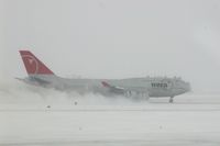 N673US @ CID - NWA9840 arriving in the snow to pick up the U of I football team. - by Glenn E. Chatfield