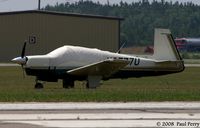 N6577U @ SFQ - Nice to see a Mooney on the grass - by Paul Perry