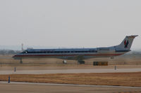 N616AE @ DFW - American Eagle at DFW - sun wind and a ..grrrr.. fence.