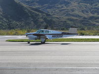N6005E @ SZP - Beech K35 BONANZA, 550 engine upgrade 300 Hp, landing roll Rwy 04 - by Doug Robertson