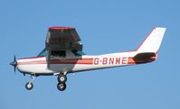 G-BNME @ EGBT - Cessna 152 landing at Turweston - by Simon Palmer