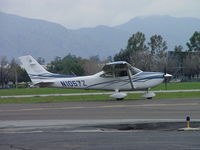 N1057Z @ POC - Taxiing to area of 26L for take off, light rain - by Helicopterfriend