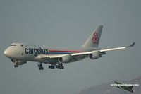 LX-FCV @ VHHH - Cargolux approaching 25R - by Michel Teiten ( www.mablehome.com )