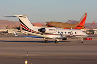 N467QS @ LAS - NetJets Aviation Gulfstream G400 N467QS taxiing to RWY 1R for departure while Southwest Airlines N773SA lands on RWY 1L. This Gulfstream G400 is headed to Santa Monica Municipal Airport (KSMO). - by Dean Heald
