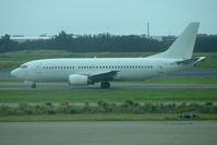 VH-NLK @ YBBN - Aeromaritime all white B737 at Brisbane - by Terry Fletcher