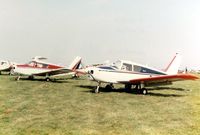G-ATOJ @ EGTC - Piper PA-28 Cherokee 140 G-ATOJ alongside Cherokee 160 G-ATDA at the 1981 Cranfield Business and Light Aviation Exhibition - by GeoffW