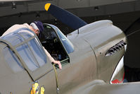 N1941P @ 42VA - The pilot of this 1941 Curtiss Wright P-40E is checking out the electrical system, as it was being charged, prior to his flight demonstration. - by Dean Heald
