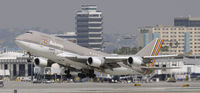 HL7418 @ KLAX - Departing LAX on 25R - by Todd Royer