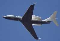 N237GA @ KSNA - Gulfstream G540 climbing the blue skies - by Mike Khansa