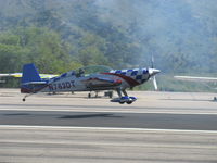 N763DT @ SZP - 2007 Extra Flugzeugproduktions EXTRA EA 300L, Lycoming AEIO-540-L1B5 300 Hp, takeoff climb Rwy 22 through dissipating airshow smoke from N64SH - by Doug Robertson