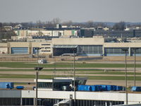 UNKNOWN @ KSTL - UNKNOWN AT FAR END BEING PUT INTO HANGER - by Gary Schenaman