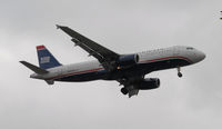 N665AW @ KLAX - Landing 24R at LAX - by Todd Royer