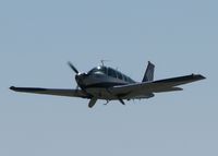 N6066S @ DTN - Off of 32 at the Shreveport Downtown airport. This Bonanza is taking off with the Greg Poe MX2. I think this is the crew/support aircraft? They have some of the same markings. - by paulp