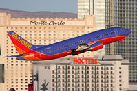 N645SW @ LAS - Southwest Airlines N645SW (FLT SWA1523) climbing out from RWY 1R, with a nice casino backdrop with early morning light, enroute to Ontario Int'l (KONT). - by Dean Heald