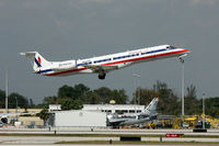 N825AE @ KMIA - Take-off. Note the 737 stripped of paint in the background. - by billysier