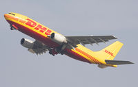OO-DLZ @ EBBR - Heavy freighter climbing steep from rwy 25R. Gear moving up. - by Philippe Bleus