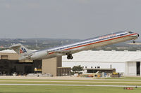 N494AA @ KSAT - AA MD-82 retracting its gear during takeoff from KSAT - by FBE