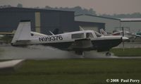 N99376 @ PVG - Finding the water on the runway - by Paul Perry