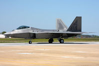 05-4094 @ LFI - USAF Lockheed Martin F-22A Raptor 05-4094 of the 94th FS Spads - Hat-in-the-Ring Gang with Major Dave Zeke Skalicky at the controls taxiing to RWY 8 to perform the F-22A Raptor Demo and Heritage Flight during Friday's practice. - by Dean Heald