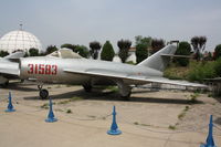 31583 - Shenyang J-5   Located at Datangshan, China - by Mark Pasqualino