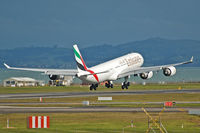 A6-ERE @ NZAA - Touching down just before the next heavy rain shower... - by Micha Lueck