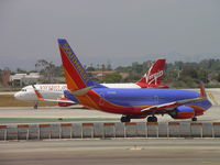 N637VA @ LAX - Starting take off roll while Southwest moves into position - by Helicopterfriend