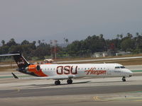 N609QX @ LAX - Horizon's Oregon State Beaver taxxing to Runway 24L - by Helicopterfriend