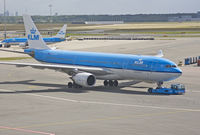 PH-AOA @ EHAM - Being towed to gate before embarking passengers. - by Philippe Bleus