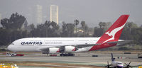 VH-OQC @ KLAX - Taxi to gate - by Todd Royer