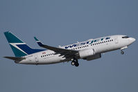 C-FKWS @ CYEG - Westjet Boeing 737-700 - by Yakfreak - VAP