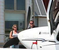 N569PG @ GED - Cirrus rep speaking to potential clients at the open house - by N12884