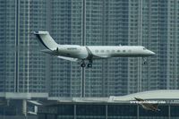 N888HK @ VHHH - Bizz jet landing in front of the towers from Tung Chung - by Michel Teiten ( www.mablehome.com )