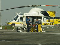 N120LA @ POC - Patient being placed on board for transportation - by Helicopterfriend