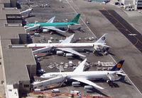B-6050 @ KLAX - China Eastern A340 (center) at the Bradley International Terminal KLAX - by Mark Kalfas
